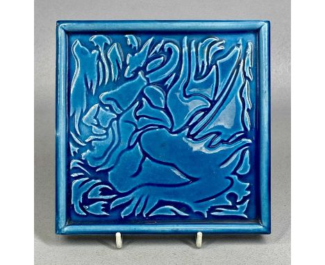 J. C. EDWARDS RUABON TURQUOISE GLAZED TILE / TEAPOT STAND, designed by C. F. A. Voysey, decorated with relief depiction of th