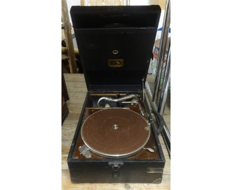 A vintage HMV wind up table top gramophone.
