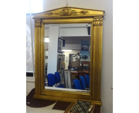 A reproduction of a Georgian gilt framed and architectural mirror,