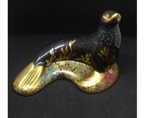 A boxed Royal Crown Derby paperweight 'Sea Lion', gold stopper, dated 2009, length 17.5cm