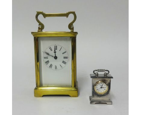 A brass cased carriage clock and a miniature clock (2).