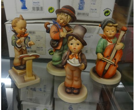 Goebel, Hummel, a collection of four large figures including Hummel Club exclusive, all boxed, list available, circa 1990's.