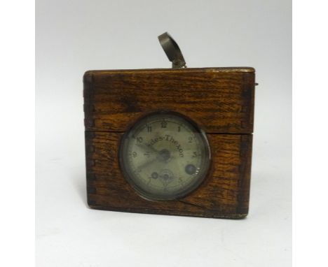 A pigeon clock inscribed 'Jundes-Thexor'.