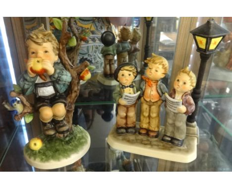 Goebel, Hummel, two figures, 'An Apple a Day' No.272 (Hum403) and 'A Tuneful Trio' 1996 limited edition (2).