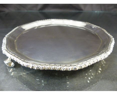 Hallmarked silver pie crust platter on tripod feet. Chased design to outer edge by Adie Brothers Ltd, Birmingham 1932 Approx 