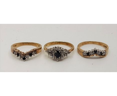 A set of three sapphire and CZ set  silver gilt rings, designed to be worn either singularly or together, in box. (3) Ring si