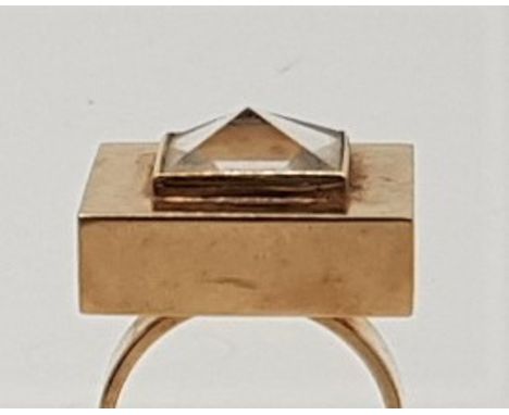 A Bruce Russell (Guernsey) 14ct. gold and rock crystal dress ring, c.1983, having large square mount set faceted rock crystal