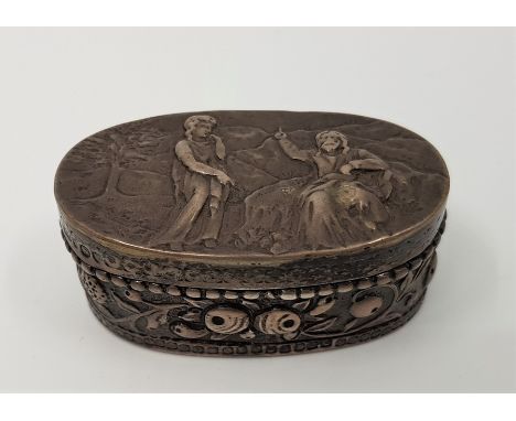 A small Victorian oval silver snuff box, import assayed London 1887, sponsors mark for Thomas Glaser, with pictorial embossed