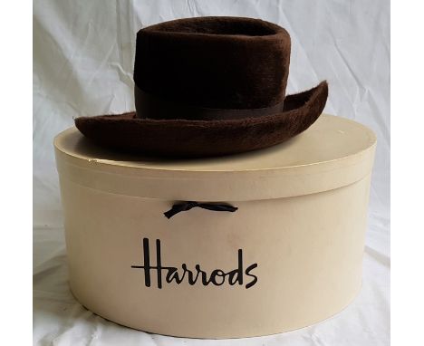 A vintage Christian Dior brown hat, c.1970's, in Harrod's oval hat box.