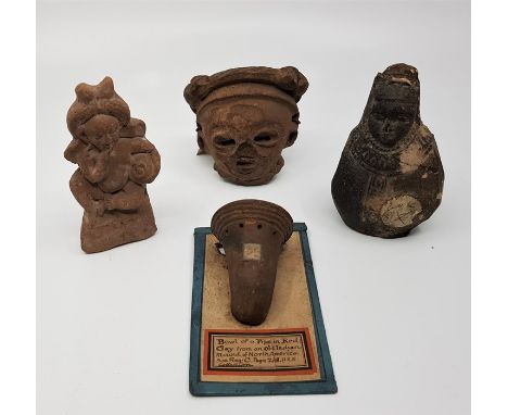 A collection of American antiquities including the bowl of a North American Indian pipe with original collectors label and a 