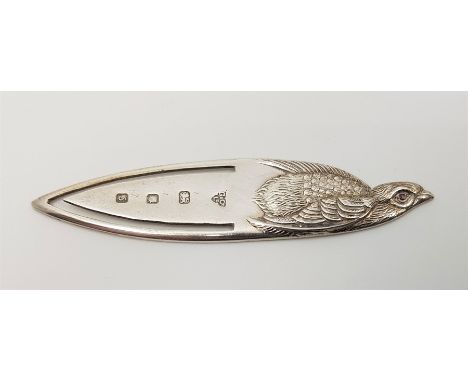 A silver "grouse" book mark by&nbsp;Garrard &amp; Co Ltd, assayed Birmingham 1992, set pink stone eye, length 6.5cm, together