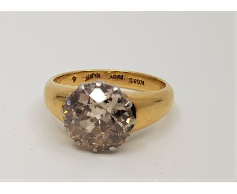 An 18ct. gold and platinum diamond solitaire ring, claw set old cut diamond (assessed diamond weight approx. 4.9 carats, colo