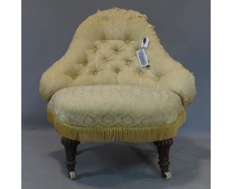 A Victorian button back upholstered chair, on gadrooned and turned legs raised on castors, H.76  W.79cm 
