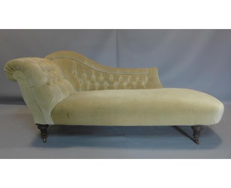A chaise longue with button back corduroy upholstery, on turned legs and castors, H.78 W.180 D.70cm 