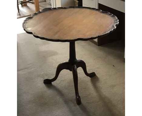 A mahogany piecrust edge circular tripod table in the Georgian style – circa 1900.