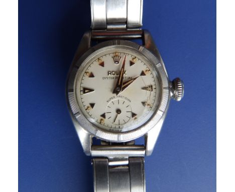 A lady's stainless steel Rolex Oyster Perpetual bubble-back bracelet wrist watch, having gold baton numerals, subsidiary seco