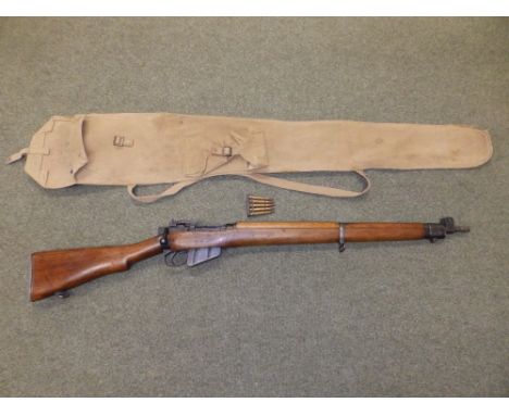 A de-activated Lee Enfield .303 rifle (strips, cocks and dry-fires) with certificate together with its webbing carry case and