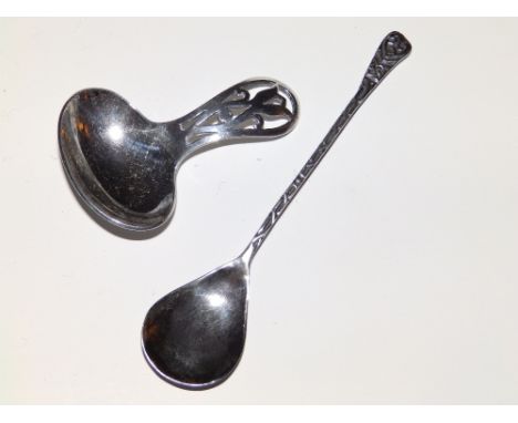 A silver caddy spoon – RP, London 1928 and one other. (2)