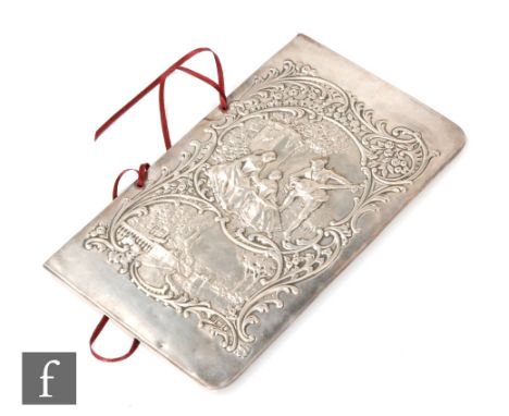 An Edwardian hallmarked silver fronted blotter decorated with a figural group in a landscape setting, length 18.5cm, London 1
