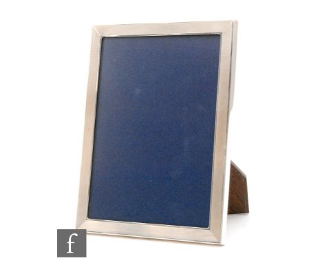 A modern hallmarked silver rectangular easel photograph frame with engine turned decoration to whole, height 20.5cm, Birmingh