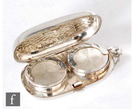 A hallmarked silver cushioned oval double sovereign case with a beaten effect to whole, length 7cm, Birmingham 1909, William 