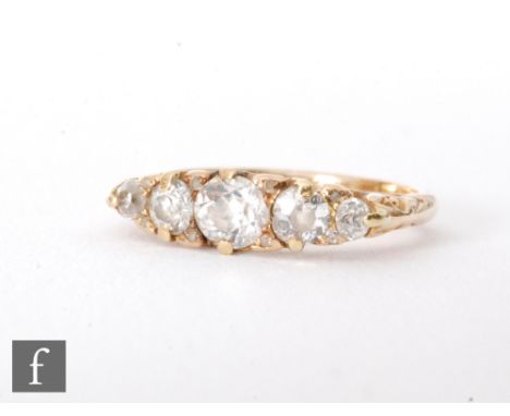 An early 20th Century 18ct boat shaped graduated diamond five stone ring, weight of centre stone approximately 0.33ct, ring s