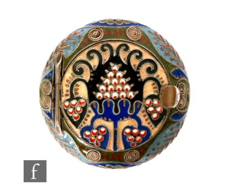 A Russian silver cloisonne enamel squat circular pill box in tonal green, blue and red enamels, diameter 4cm, attributed to F