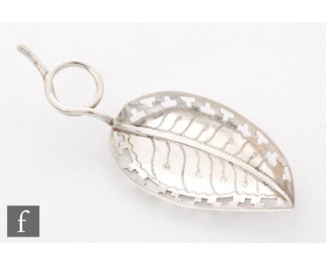 A hallmarked Britannia silver caddy spoon modelled as a leaf with pierced borders and stalk handle, length 8cm, Birmingham 19