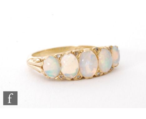 A modern 18ct hallmarked opal and diamond five stone ring in the Edwardian style, ring size M 1/2. 