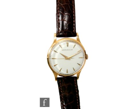 A mid 20th Century 18ct gentleman's Jaeger Le Coultre manual wind wrist watch, gold batons to a circular off white dial, all 