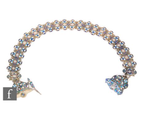 A 19th century Russian silver and cloisonné enamel belt, twenty three rectangular panels with blue and red enamel, the shield