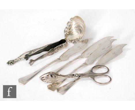 Seven early 20th Century items of continental silver and white metal flatware to include an Art Nouveau ladle and sugar tongs