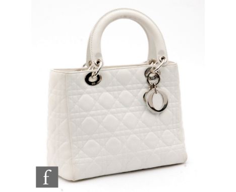 A Christian Dior Lady Dior handbag, with quilted Cannage pattern, the polished silver metal hardware stamped CD and retains D