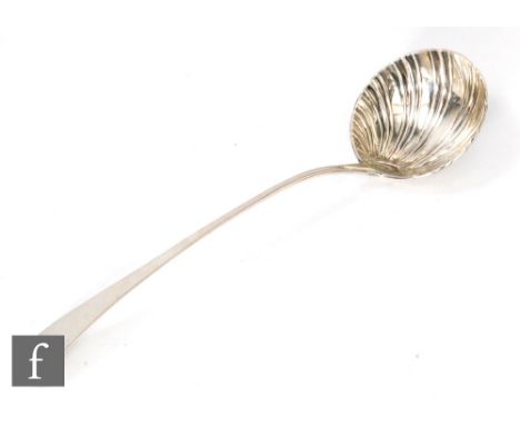 A  George III hallmarked silver old English ladle with shell bowl below plain handle, length 37cm, weight 7.5oz, London 1770,