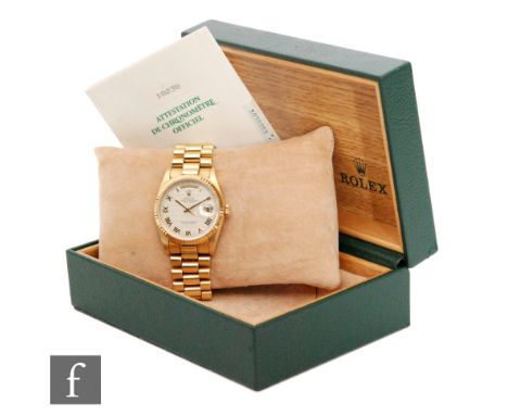 A gentleman's 18ct Rolex Oyster Perpetual Day Date wrist watch with Roman numerals day aperture at 12 o'clock and date apertu