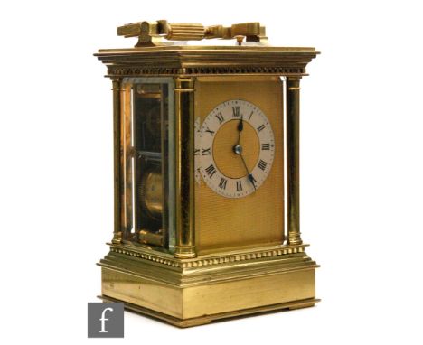 A late 19th Century French brass carriage clock with push button repeater, silvered chapter ring to a matted gilt centre flan