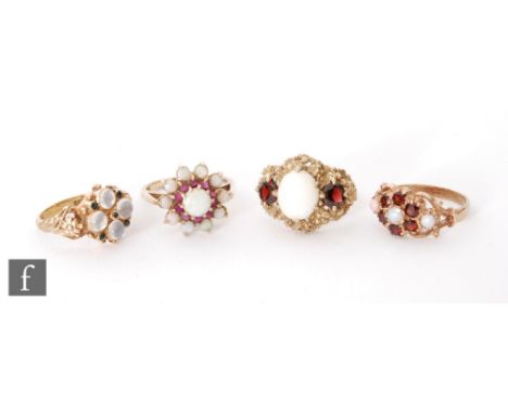 Three 9ct hallmarked opal and garnet dress rings to include three stones and cluster examples, total weight 13g. 