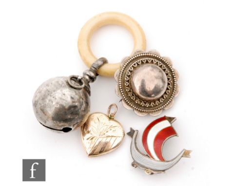 A Norwegian enamelled brooch modelled as a Viking  ship, Asrel Holmson, with a silver baby's rattle, a heart shaped locket an