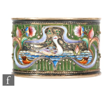 A Russian silver gilt and cloisonne enamelled oval napkin ring decorated with a swimming bird within pink floral sprays to a 