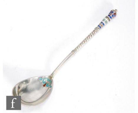 A Russian silver gilt and cloisonne enamel spoon decorated with red, white, blue, black and turquoise foliate details, length