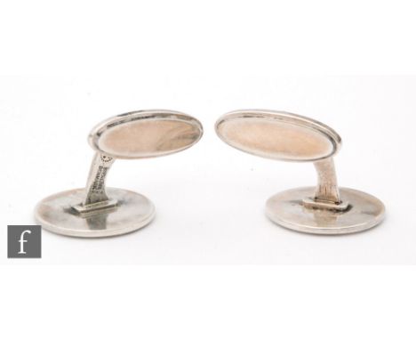 A pair of Danish silver swivel cufflinks of plain circular form, Georg Jensen. 