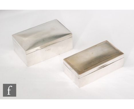 A hallmarked silver cigarette box of plain rectangular form, with a similar example with engine turned decoration to lid, bot