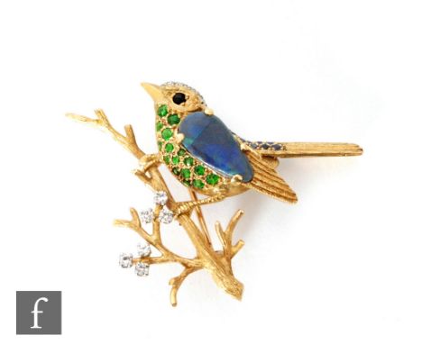 A mid 20th Century 18ct opal, diamond, green tourmaline and sapphire set brooch modelled as a bird perched on a branch, lengt