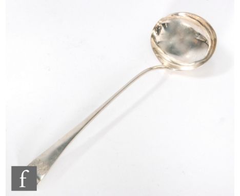 A George III hallmarked silver old English pattern soup ladle of plain form, length 33cm, London 1796, Solomon Hougham. 