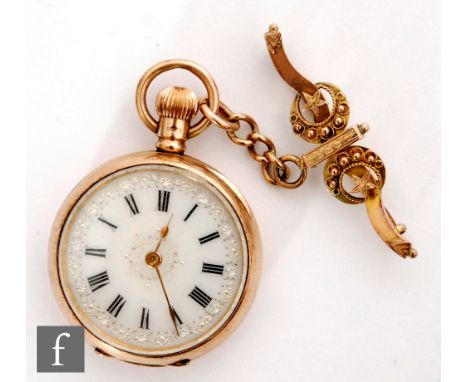 An early 20th Century 9ct lady's crown wind open faced fob watch, Roman numerals to a white enamel dial within silver floral 