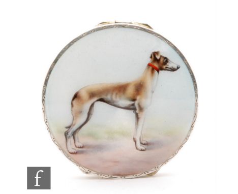 A hallmarked silver circular box with enamelled study of a standing dog to the hinged cover, diameter 5cm, import mark, Londo