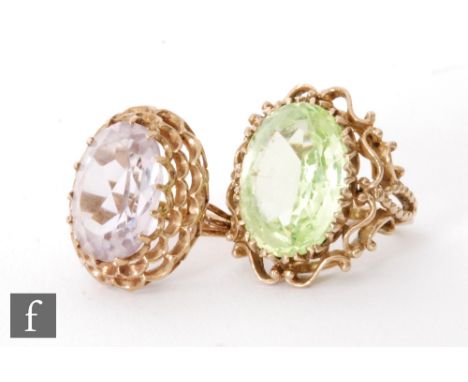 A modern 9ct hallmarked single stone amethyst ring to a stepped scalloped head, with a similar green stone example, total wei