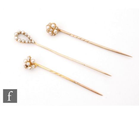 Three 19th Century pearl and diamond set stick pins, two circular and one oval example. (3) 