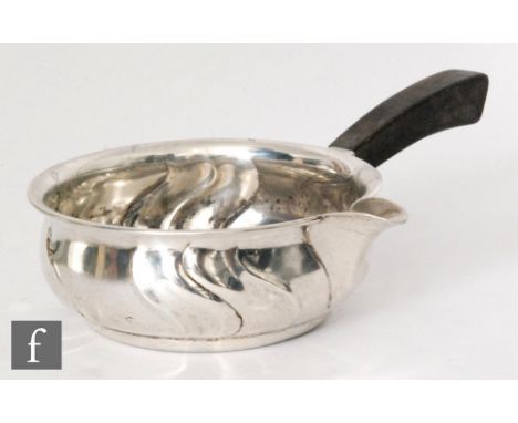 A Danish silver brandy warmer, the circular part fluted bowl with plain spout and tapering wooden side handle, diameter 12cm,