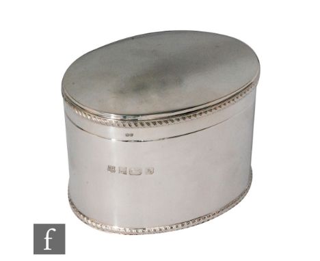 A modern hallmarked silver oval caddy of plain form with rope twist detail to borders, length 13.5cm, weight 18.5oz, Birmingh